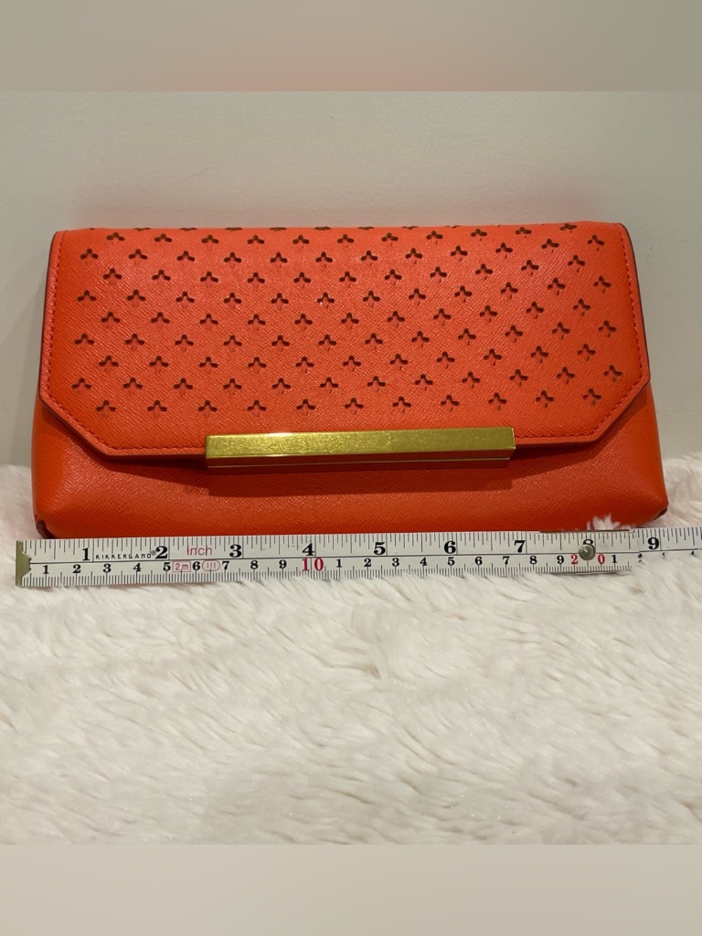 Orange Perforated Leather Clutch with Gold Bar Accent